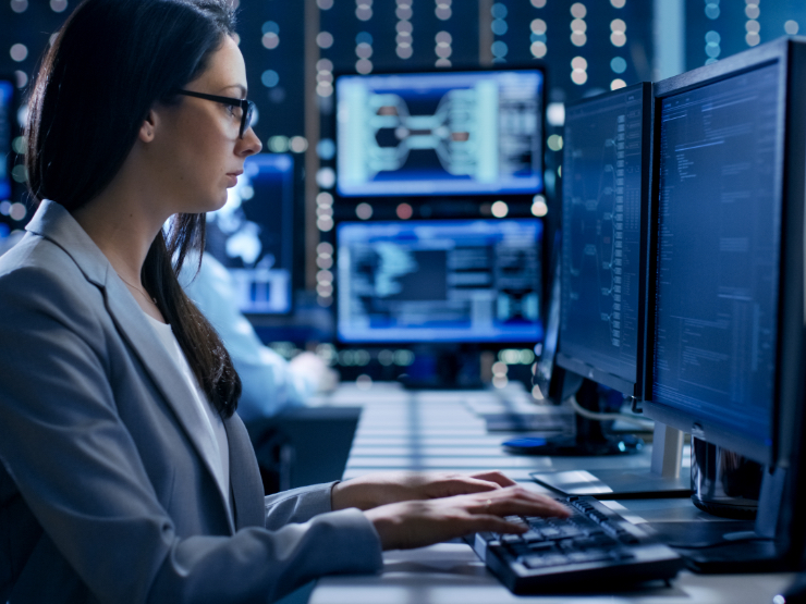 Business professional working at the data center desk