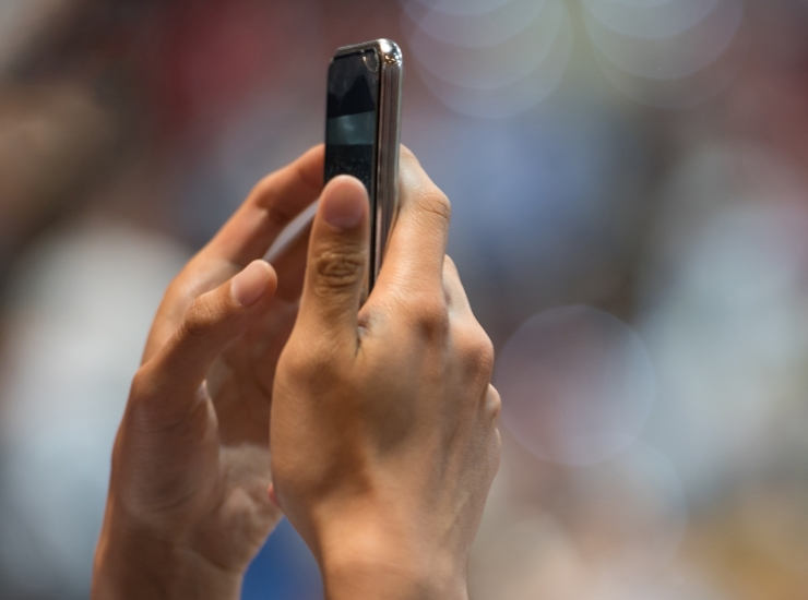 Person holding a mobile phone